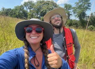 Ashley Landes and Benjamin Virnston trying to beat the heat with their field hats during plant diversity at SCBI.