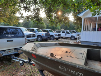 The Domain 03 trucks lined up in front of the staff house in Georgia