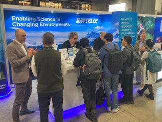 People at a conference booth