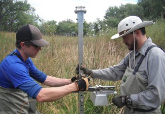 Field technicians collecting AIS data at ARIK