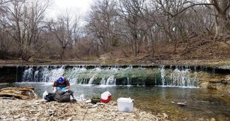 Field technicians preparing for benthic sampling at McDiffett Creek (MCDI)